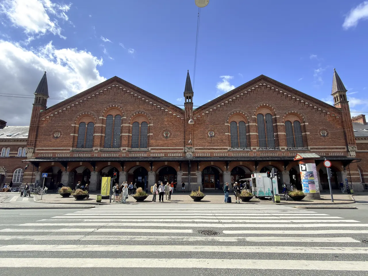 The Bernstorffsgade facade in fair-faced red brick, with slate roofs and corner towers.